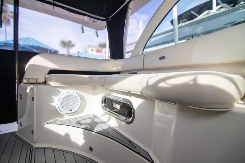Slide: The Image of Interior of 2013 Pursuit OS 345 Offshore boat with cushioned seating and speaker. - 15