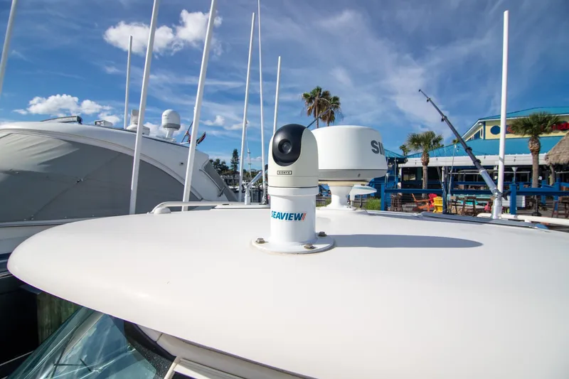 Slide: The Image of 2013 Pursuit OS 345 Offshore boat with radar and camera equipment on deck. - 28