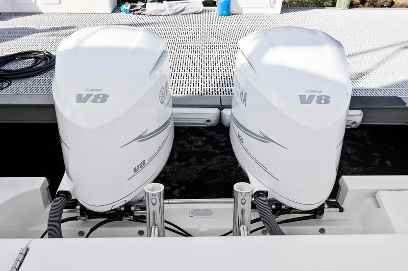 Slide: The Image of Twin Yamaha V8 engines on a 2013 Pursuit OS 345 Offshore boat. - 29