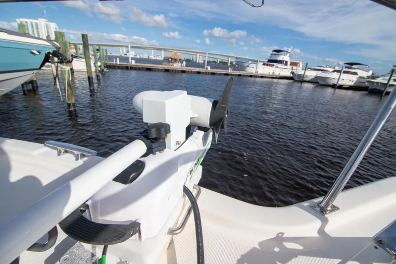 Slide: The Image of 2013 Pursuit OS 345 Offshore boat docked at marina with clear blue sky. - 32
