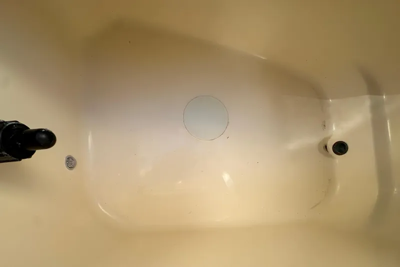 Slide: The Image of Interior view of a 2025 Scout 195 Sport Dorado boat, showcasing a clean, beige surface. - 14