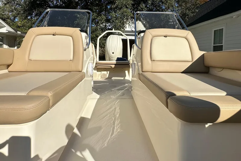 Slide: The Image of 2025 Scout 195 Sport Dorado boat interior with beige seating and sleek design. - 23