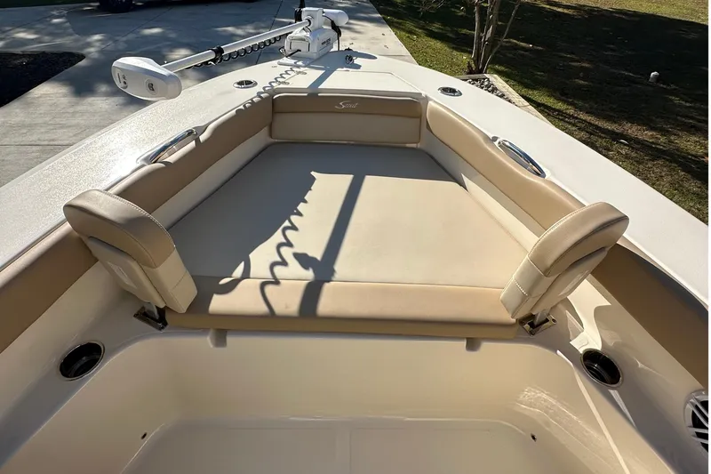 Slide: The Image of 2025 Scout 195 Sport Dorado boat interior with beige seating and modern design. - 27