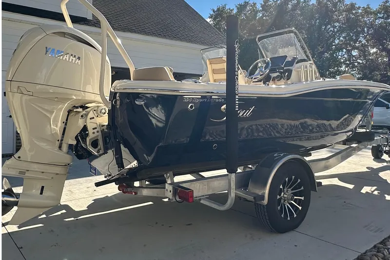 Slide: The Image of 2025 Scout 195 Sport Dorado boat on trailer with Yamaha outboard motor. - 4