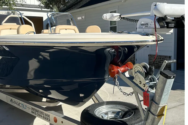 Slide: The Image of 2025 Scout 195 Sport Dorado boat on trailer, parked in driveway. - 6