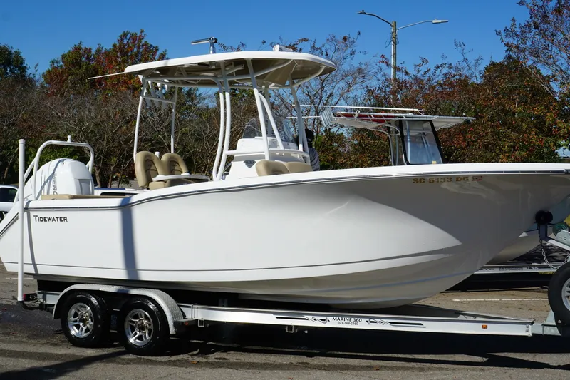 Slide: The Image of 2015 Tidewater 230 LXF boat on trailer, parked outdoors, side view. - 5