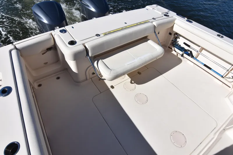 Slide: The Image of 2017 Grady-White Express 330 boat deck with seating and twin engines. - 10