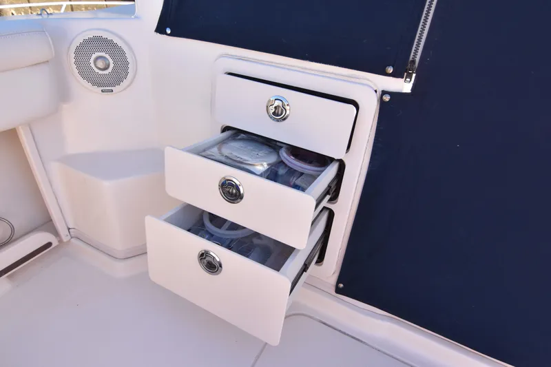 Slide: The Image of Storage drawers on 2017 Grady-White Express 330 boat, featuring organized compartments. - 13