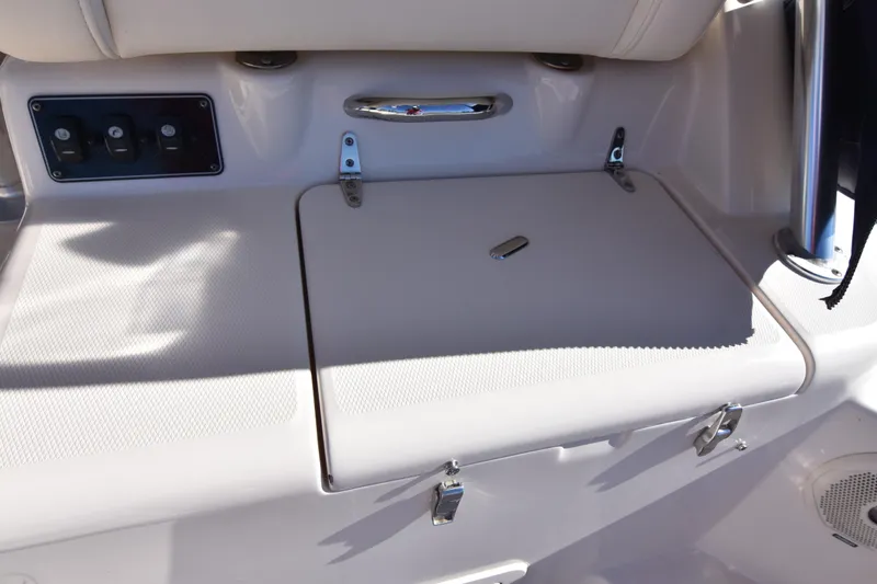 Slide: The Image of 2017 Grady-White Express 330 boat interior with storage compartment and control panel. - 16