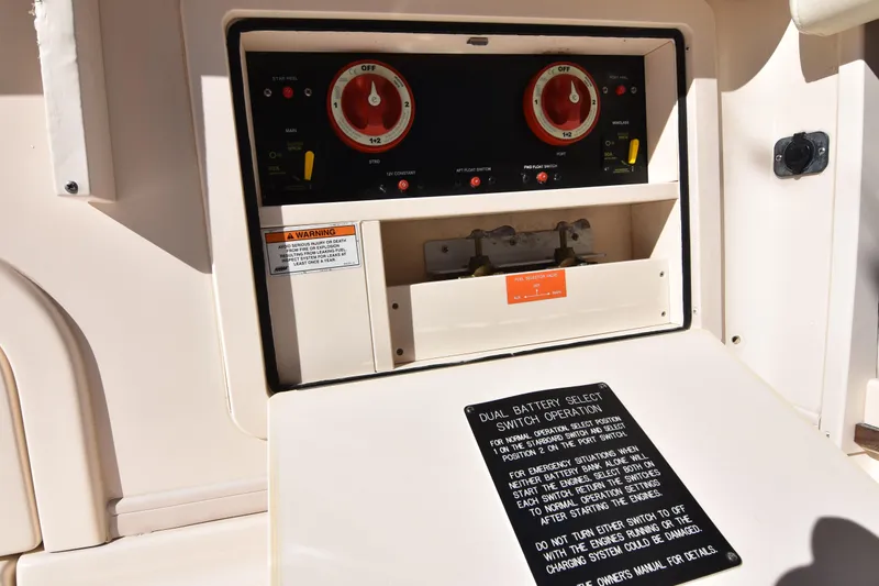 Slide: The Image of Control panel of a 2017 Grady-White Express 330 boat, featuring dual battery switches. - 21