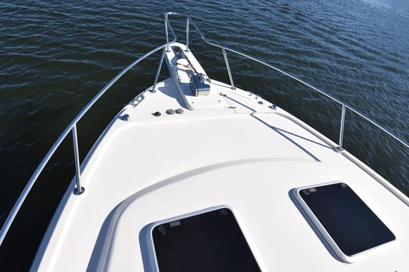 Slide: The Image of 2017 Grady-White Express 330 boat deck on calm water. - 37