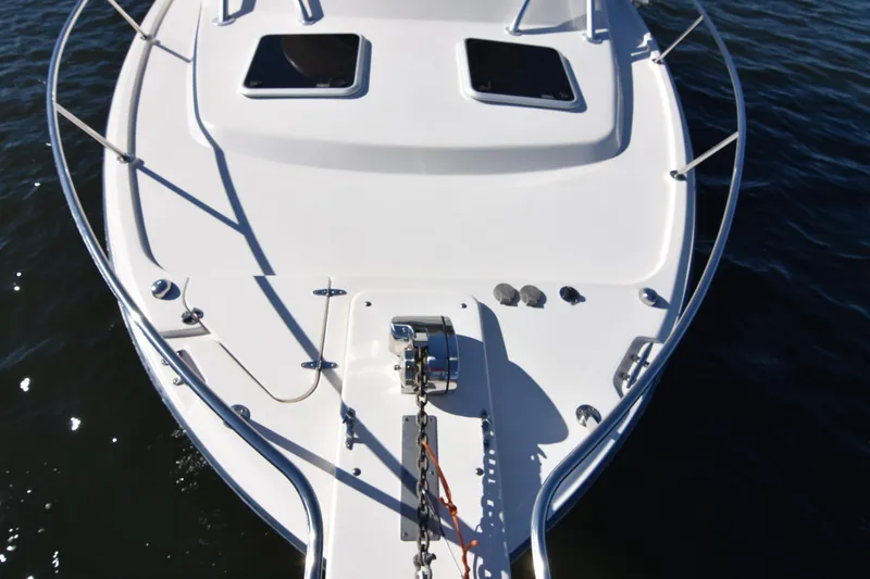 Slide: The Image of 2017 Grady-White Express 330 boat deck with anchor, on calm water. - 38