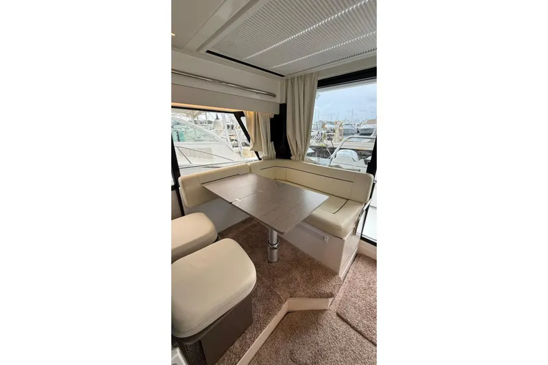 Slide: The Image of Luxurious interior of 2023 Wellcraft 355 yacht with elegant seating and table. - 11