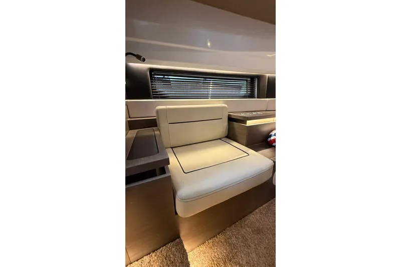 Slide: The Image of Interior seating of 2023 Wellcraft 355 boat with modern design and comfortable upholstery. - 18