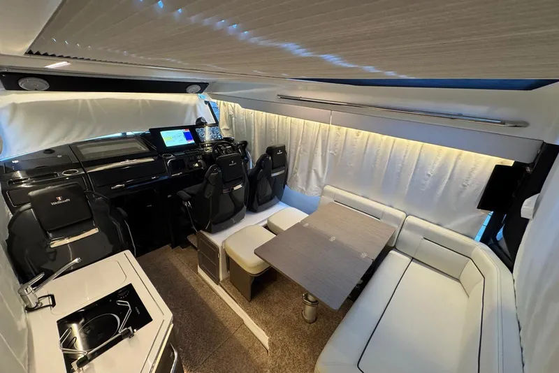 Slide: The Image of Luxurious interior of 2023 Wellcraft 355 boat with modern seating and navigation area. - 22