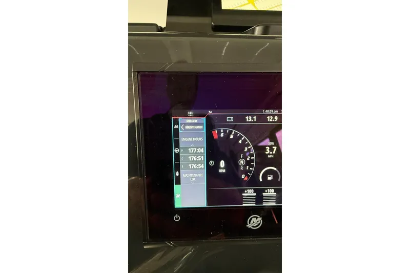 Slide: The Image of Display screen of 2023 Wellcraft 355 boat showing engine hours and speed. - 8