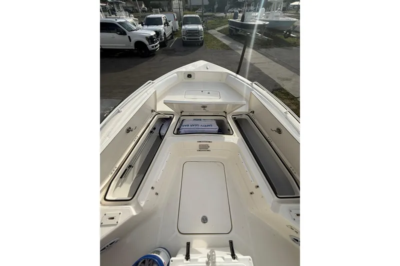 Slide: The Image of 2026 Skeeter SX2550 Family boat interior with storage compartments and safety gear. - 20