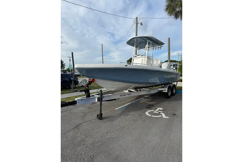 Slide: The Image of 2026 Skeeter SX2550 Family boat on trailer in parking lot. - 3
