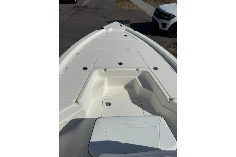 Slide: The Image of 2025 Skeeter SX221 boat deck, featuring spacious seating and storage compartments. - 5