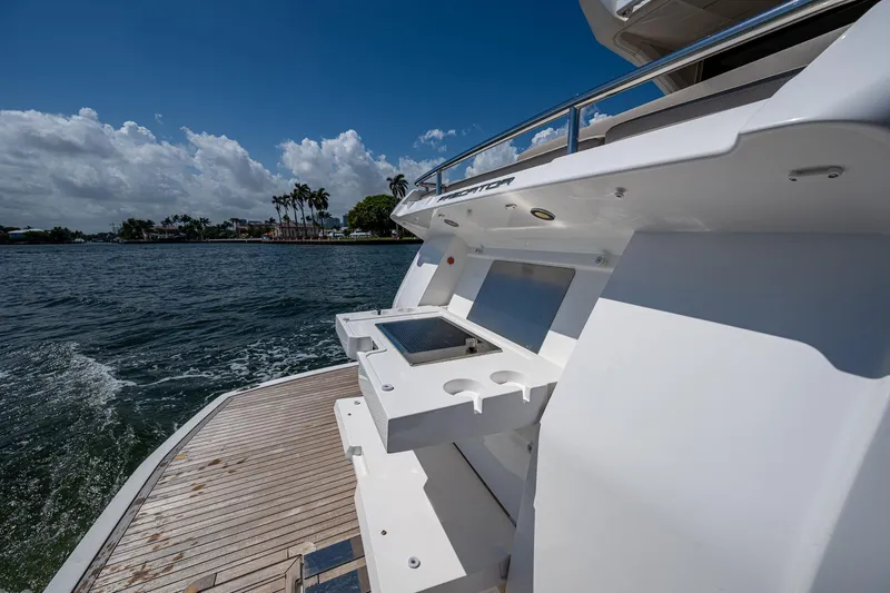 Slide: The Image of 2019 Sunseeker Predator 50 yacht with sleek deck and ocean view. - 10