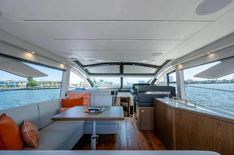 Slide: The Image of Interior of 2019 Sunseeker Predator 50 yacht with modern seating and panoramic windows. - 28