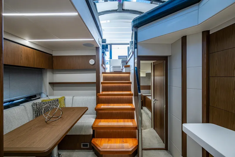 Slide: The Image of Luxurious interior of 2019 Sunseeker Predator 50 yacht with wooden stairs and modern seating area. - 40