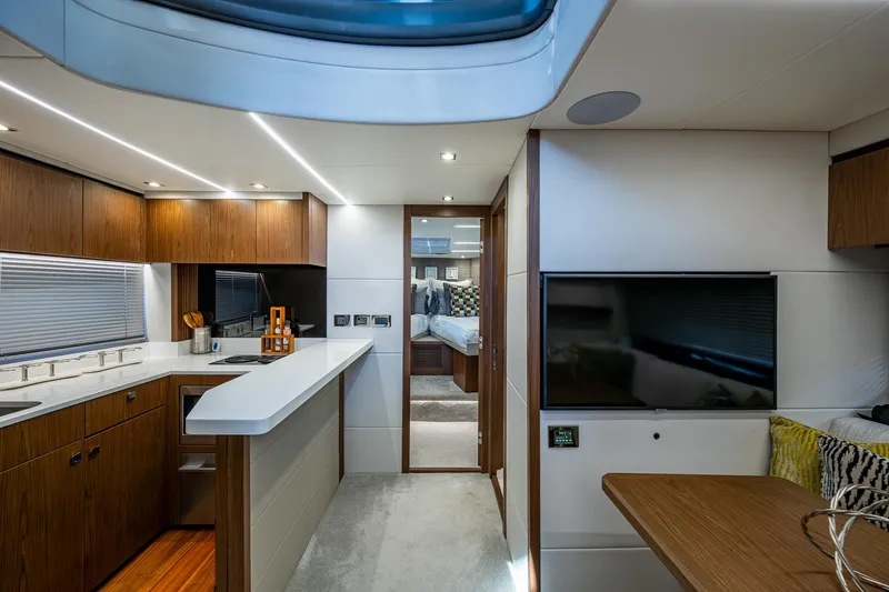 Slide: The Image of Luxurious interior of 2019 Sunseeker Predator 50 yacht with modern kitchen and cozy living area. - 42