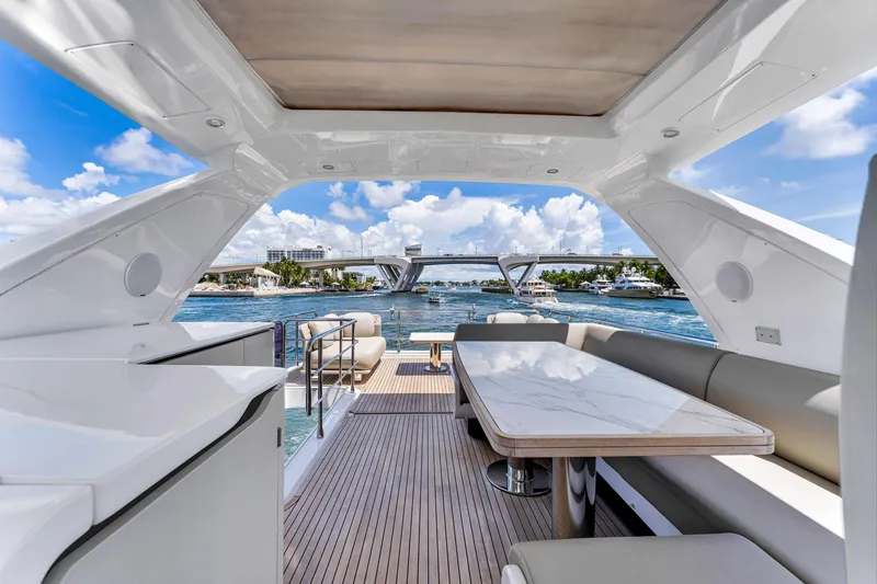 Slide: The Image of Luxurious 2022 Azimut Fly 60 yacht interior with elegant seating and scenic waterway view. - 17