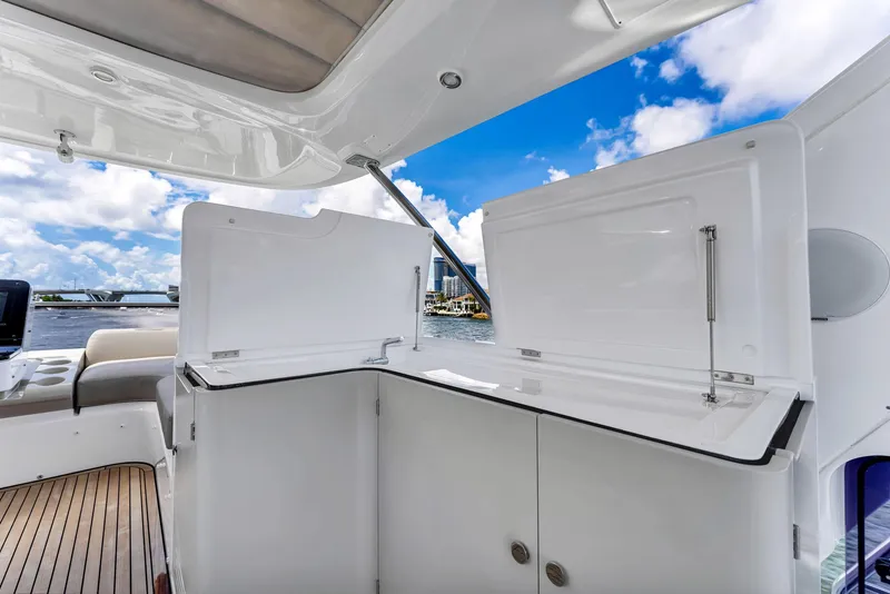Slide: The Image of Luxurious Azimut Fly 60 yacht interior, featuring sleek cabinetry and stunning ocean views. - 20