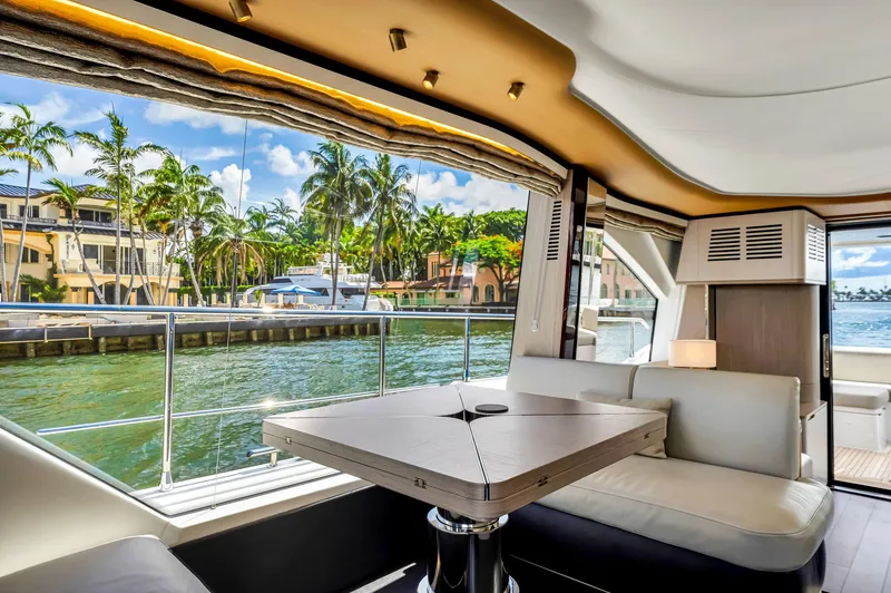 Slide: The Image of Luxurious interior of 2022 Azimut Fly 60 yacht with waterfront view and modern seating. - 32