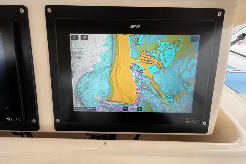 Slide: The Image of Navigation display on 2007 Grady-White Express 330 showing detailed marine chart. - 19