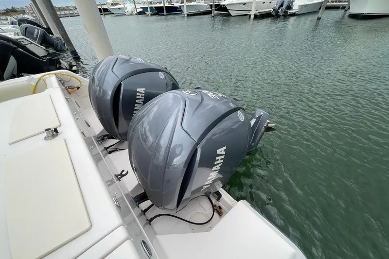 Slide: The Image of 2007 Grady-White Express 330 with twin Yamaha outboard motors docked at marina. - 48