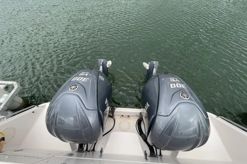 Slide: The Image of Twin Yamaha 300 engines on a 2007 Grady-White Express 330 boat. - 49
