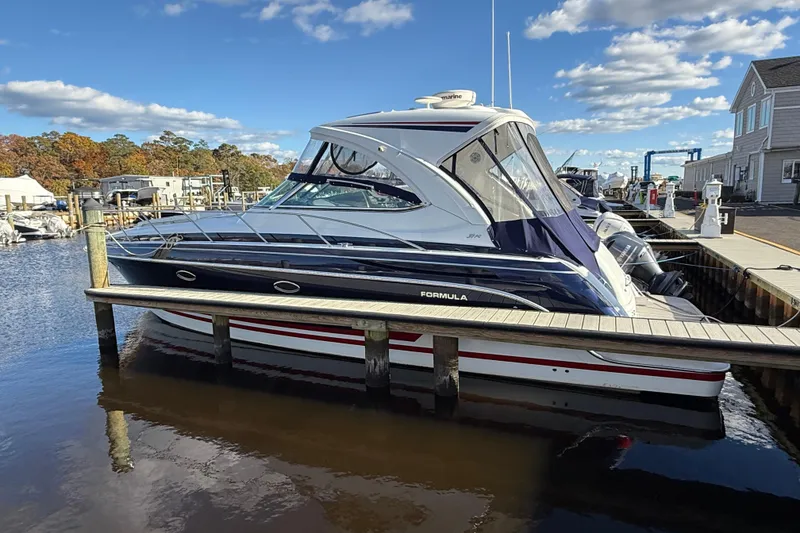 Slide: The Image of 2015 Formula 37 Performance Cruiser on calm water, overcast sky. - 1