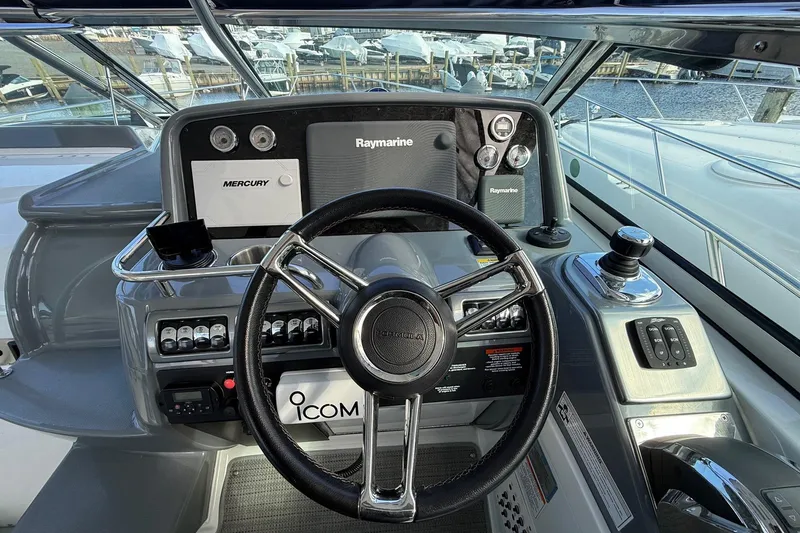 Slide: The Image of 2015 Formula 37 Performance Cruiser docked under a clear blue sky. - 10