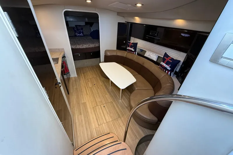 Slide: The Image of 2015 Formula 37 Performance Cruiser docked at a marina under a clear blue sky. - 11