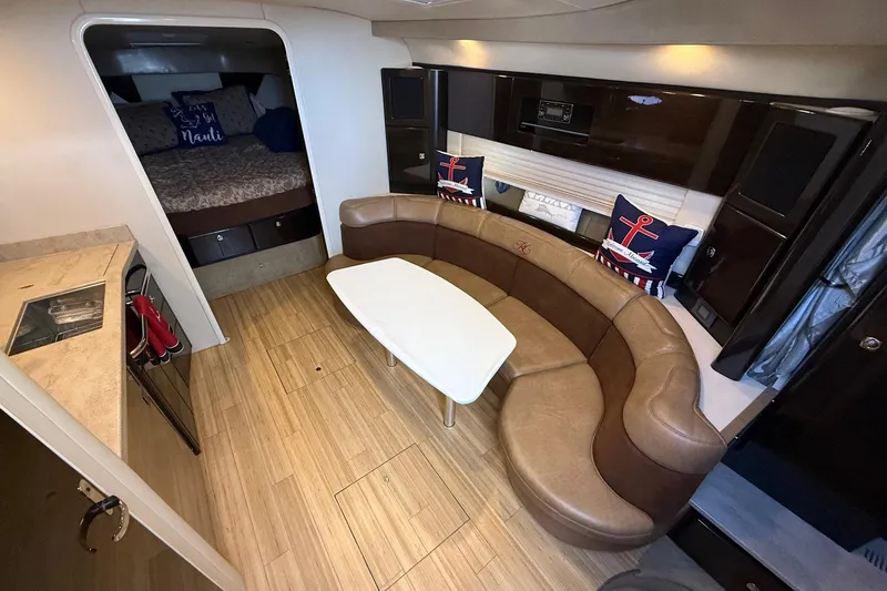 Slide: The Image of 2015 Formula 37 Performance Cruiser docked at marina under blue sky. - 12