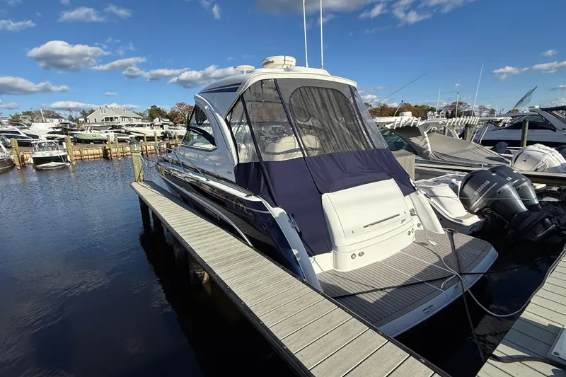 Slide: The Image of 2015 Formula 37 Performance Cruiser on calm water, overcast sky background. - 2