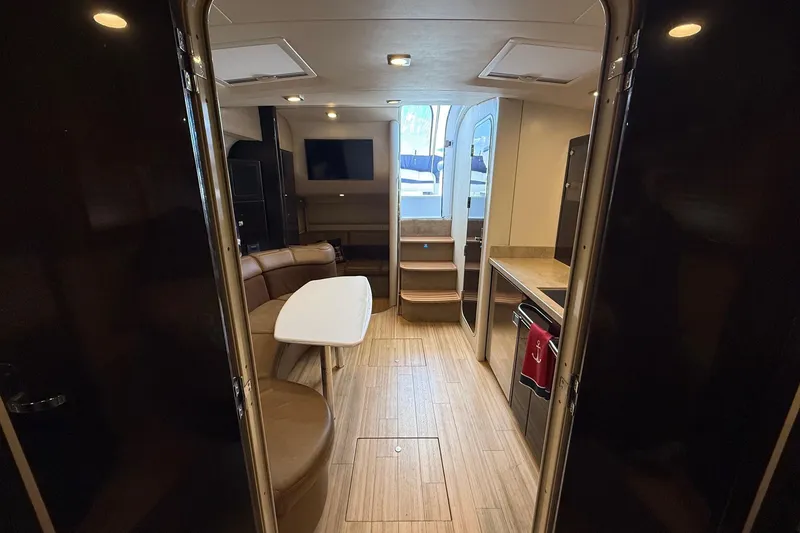 Slide: The Image of 2015 Formula 37 Performance Cruiser interior with cozy seating and nautical decor. - 22