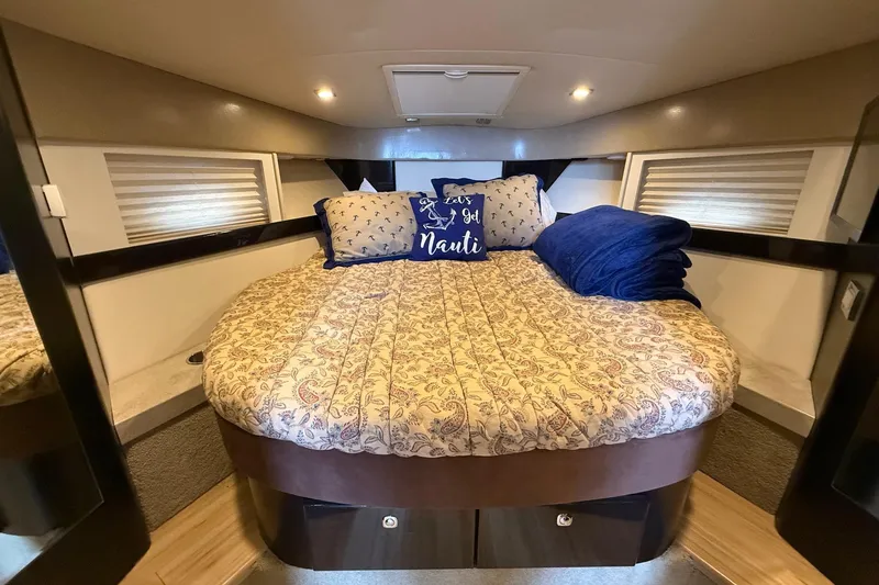 Slide: The Image of 2015 Formula 37 Performance Cruiser cabin with cozy bed and nautical decor. - 30
