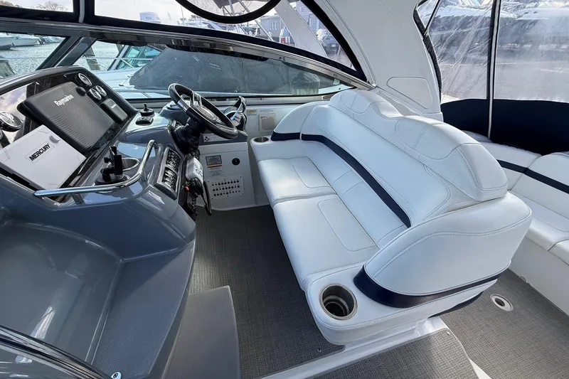 Slide: The Image of 2015 Formula 37 Performance Cruiser docked in a serene waterway setting. - 9