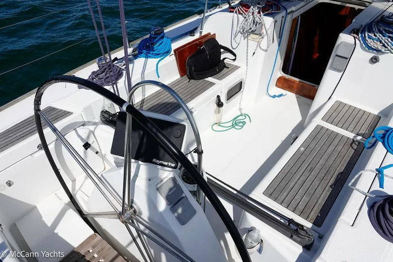Slide: The Image of Cockpit of 2005 Beneteau First 44.7 sailboat with steering wheel and nautical equipment. - 14