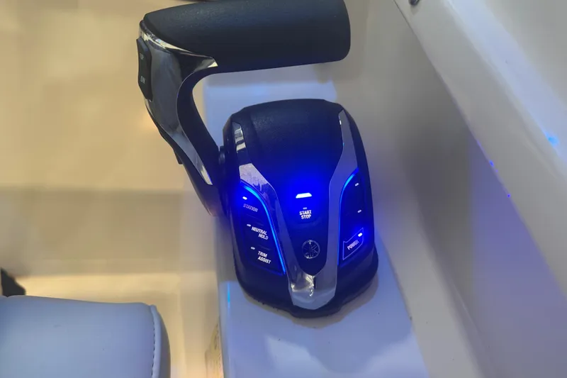 Slide: The Image of Throttle control of 2024 Pursuit DC 246 Dual Console with illuminated buttons. - 17