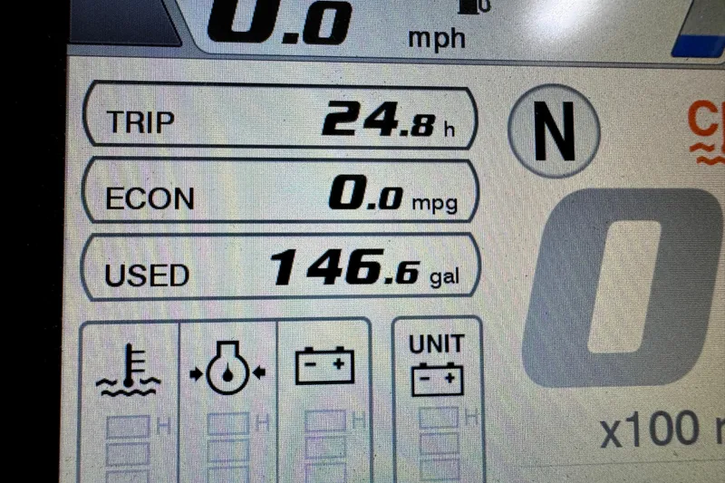 Slide: The Image of 2024 Pursuit DC 246 Dual Console dashboard showing trip, economy, and fuel usage data. - 19