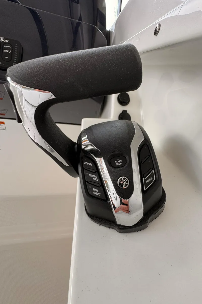 Slide: The Image of 2024 Pursuit DC 246 Dual Console boat throttle control, featuring ergonomic design and modern controls. - 34