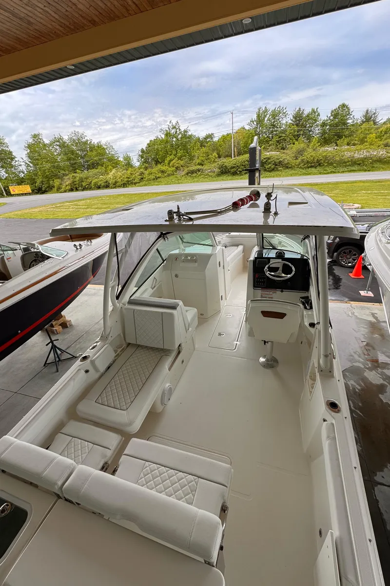 Slide: The Image of 2024 Pursuit DC 246 Dual Console boat with spacious seating and modern design. - 42