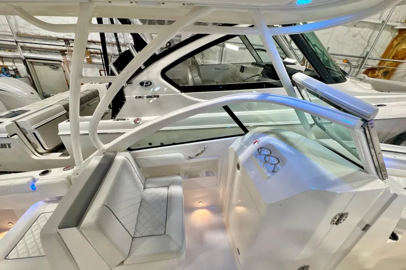 Slide: The Image of 2024 Pursuit DC 246 Dual Console boat interior with sleek seating and modern design. - 9