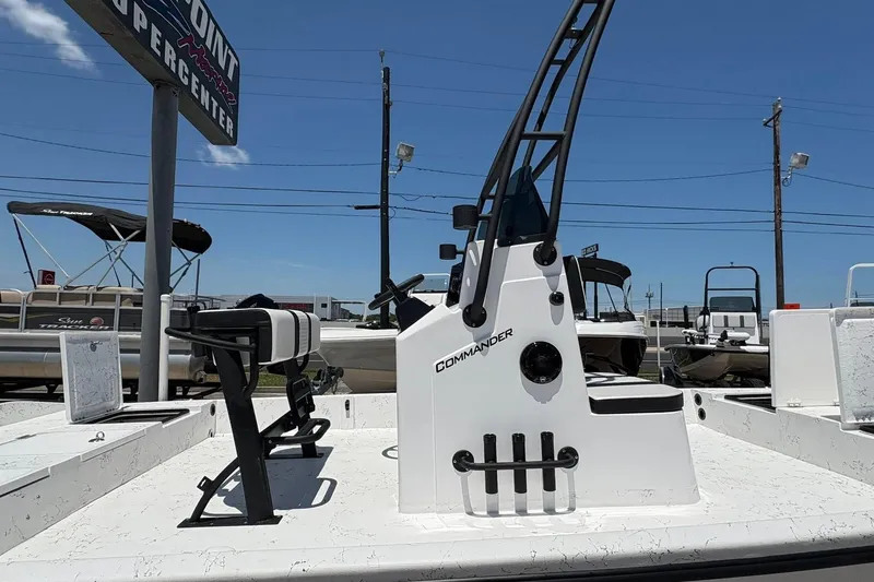Slide: The Image of 2026 Freedom Boats 21' Commander, white deck, outdoor display, clear blue sky. - 13