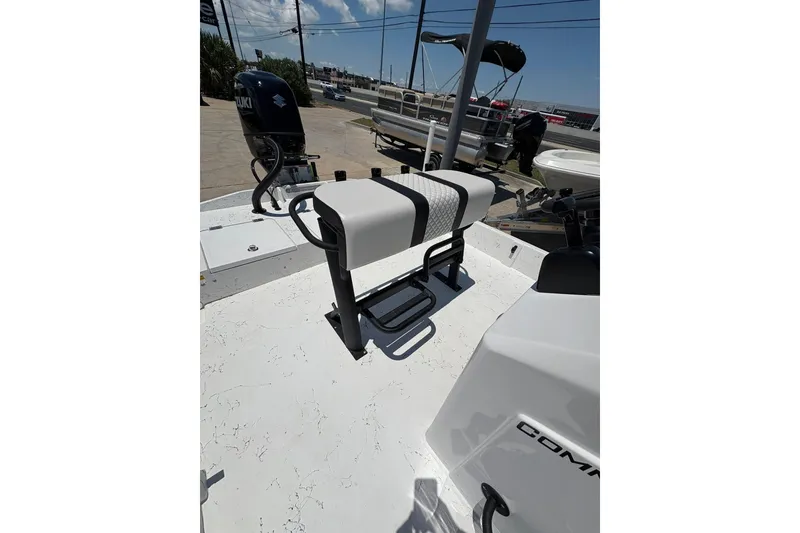 Slide: The Image of 2026 Freedom Boats 21' Commander with Suzuki outboard motor, featuring a sleek seating area. - 2
