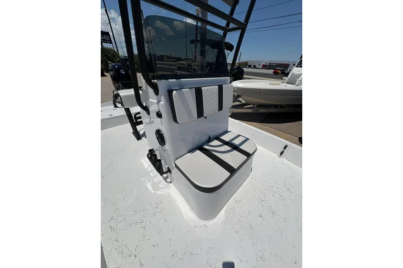 Slide: The Image of 2026 Freedom Boats 21' Commander console with seating, showcasing modern design and functionality. - 22